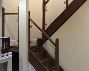 BOX STAIR-SMALL LANDING-NEW STRINGERS-SOLID OAK DARK STAIN-GLASS RAILING-SQUARE SOLID OAK WOOD POST-AFTER RENOVATION-DOWN TOWN TORONTO