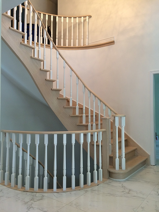 circular-stair-tread-and-riser-replacement-new-custom-make-nosing-re-veneering-stringers-new-railing-in-white-spindles-new-posts-installation-in-mississauga